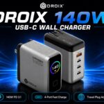 DROIX 140W USB-C wall charger advertisement showing two sleek charging blocks with blue neon background.