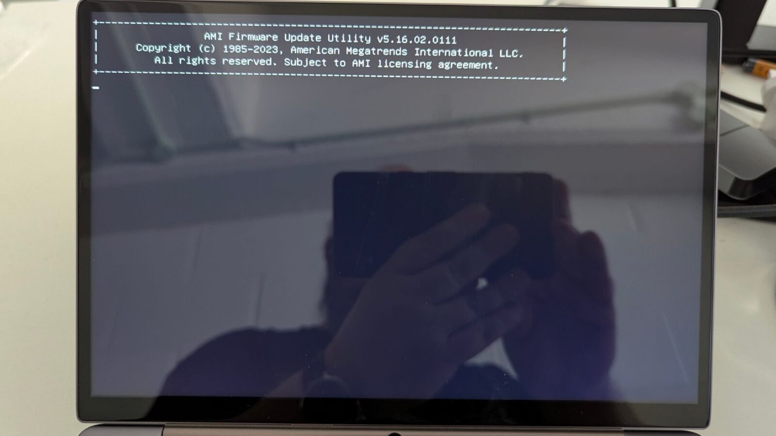After a few moments, the AMI Firmware Update Utility screen will ...
