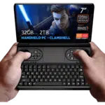GPDWINMINI2024LISTINGNEWESTDONE01322 DROIX Global GPD WIN Mini 2024 Powerful handheld gaming PC with 7 FHD 120Hz VRR display Features AMD Ryzen 7 8840U 32GB RAM 2TB NVMe storage Clamshell design combines full QWERTY keyboard with gaming controls including dual joysticks and buttons Compact form factor held comfortably in hands Screen displays game character with glowing sword showcasing vibrant graphics Specs visible 7 screen 120Hz VRR Ryzen 7 8840U 32GB RAM 2TB storage HANDHELD PC CLAMSHELL emphasized AMD Ryzen and Radeon logos present Device offers portable gaming and productivity in one bridging gap between handheld console and mini laptop