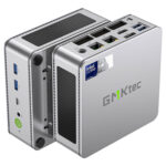 The image showcases the GMKTEC NUBOX K9 Mini PC in a stylish silver finish, adding a touch of elegance to its sleek design. The silver color enhances its modern aesthetic, making it an attractive addition to any workspace. The GMKTEC logo is subtly displayed on the top surface. Overall, the image highlights the sophisticated appearance of the GMKTEC NUBOX K9 Mini PC in silver