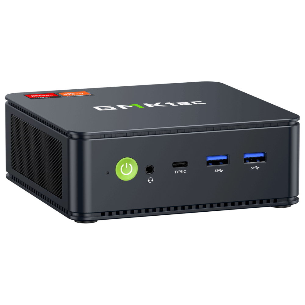 The image shows the GMKTEC NUBOX M5 Mini PC, a sleek and compact computing device. It has a modern design with a matte black finish. The front panel features several connectivity ports, including USB ports and an audio jack, and the GMKTEC logo is prominently displayed on the top. The overall design is minimalist, emphasizing portability and functionality for diverse computing tasks.