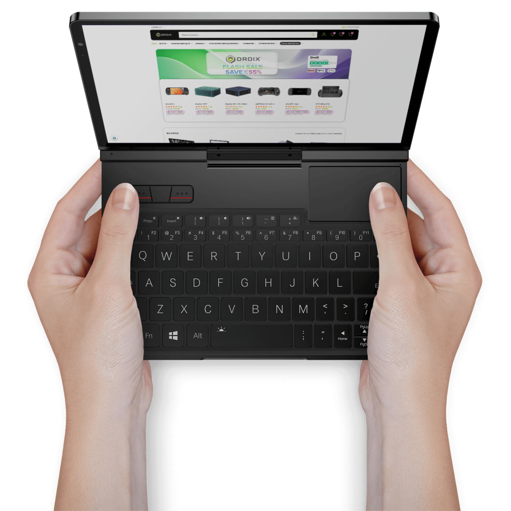 Hands holding the GPD Pocket 4 mini laptop, showcasing its portability and the compact keyboard layout, with a web page open on the screen.