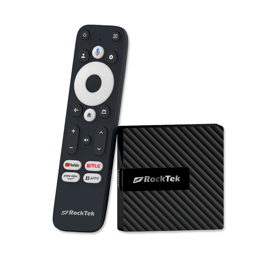 RockTek GB1 Android TV box shown alongside its dedicated remote control. The compact device has a sleek, textured design. The remote features a circular navigation pad, voice control button, and dedicated buttons for popular streaming services like YouTube, Netflix, and Prime Video, along with an 'Apps' button for quick access to installed applications