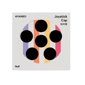 A product image for "AYANEO Joystick Cap" on a light grey background. The center features a circular design with six black circular cutouts, arranged like the pips on a domino, over a background of vertical stripes in purple, orange, and pink. The top left corner displays "AYANEO" in black text, and the top right corner has "Joystick Cap" in English and "摇杆帽" in Chinese, both in black text. A small, stylized "M" logo is present in the bottom left corner.