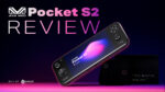 A dynamic thumbnail image for a video review of the AYANEO Pocket S2 The background is a gradient from dark purple to pink A black AYANEO Pocket S2 handheld gaming console is angled in the center with its screen displaying the logo AYANEO Pocket S2 and a colorful abstract design In the background a second blurred out black console and a box are visible Large white text in the upper left reads Pocket S2 REVIEW with the AYANEO logo above it The bottom left corner has BUY AT followed by the white and green DROIX logo The bottom right corner contains an asterisk and the text the better option in a small white font