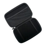 A top down angled shot of the black hard shell case for the GPD MicroPC 2 opened to reveal its interior The top half of the case has a mesh pocket for accessories while the bottom half has two elastic straps to securely hold the device The case is empty