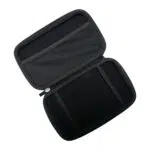 A top down angled shot of the black hard shell case for the GPD MicroPC 2 opened to reveal its interior The top half of the case has a mesh pocket for accessories while the bottom half has two elastic straps to securely hold the device The case is empty