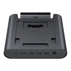 A three-quarter frontal view of a black GPD WIN 5 docking station, isolated against a black background. The dock features an array of ports on the front edge, including USB-C, USB-A, and an RJ45 Ethernet port. The recessed top area is designed to hold the GPD WIN 5 and includes a connector for charging and data.