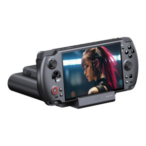 A black GPD WIN 5 handheld console is shown docked into its matching black charging/data dock, angled forward against a white background. The console's screen displays a close-up image of a female character with pink hair and cybernetic enhancements. The device's controls and the dock's four LED indicators are clearly visible.