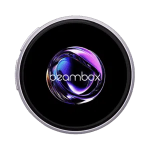 A circular badge or display framed by a light purplelavender colored metal ring The black display area shows a highly reflective swirling purple and NIKKO BADGE TS SLIVER IMAGE 1png A circular badge or display framed by a silver metal ring The black display area shows a highly reflective swirling purple and blue abstract orb with the white text beambox overlaid near the bottom The image is set against a dark green backgroundabstract orb with the white text beambox overlaid near the bottom The image is set against a dark green background