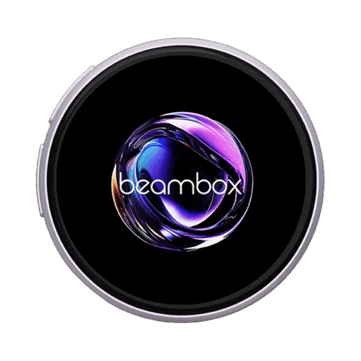 A circular badge or display framed by a light purplelavender colored metal ring The black display area shows a highly reflective swirling purple and NIKKO BADGE TS SLIVER IMAGE 1png A circular badge or display framed by a silver metal ring The black display area shows a highly reflective swirling purple and blue abstract orb with the white text beambox overlaid near the bottom The image is set against a dark green backgroundabstract orb with the white text beambox overlaid near the bottom The image is set against a dark green background