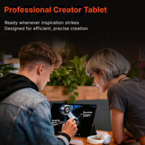Two people looking at the SuperX tablet being used with a stylus for professional design and creation tasks.
