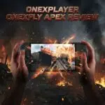 A hand holding a ONEXFLY APEX gaming handheld with explosions on the screen