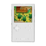 A front facing view of the AYANEO Pocket DMG in a clean whitesilver finish The screen displays a colorful farming simulation game The D pad and action buttons are white with a translucent quality matching the minimalist aesthetic of the console