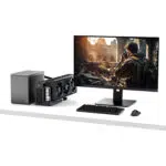 Minimalist desk setup featuring the gunmetal GPD G2 eGPU enclosure alongside a sleek PC case and high-resolution creative monitor.