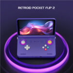 Open purple handheld gaming console with glowing purple ring lights and a vibrant screen; title 'RETROID POCKET FLIP 2' above it