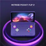 Open purple handheld gaming console with glowing purple ring lights and a vibrant screen title RETROID POCKET FLIP 2 above it