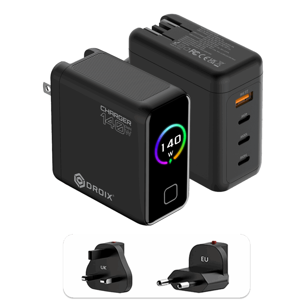 A detailed product graphic showing two views of the black DROIX 140W USB-C Wall Charger and its interchangeable international adapters. The top-left view displays the charger's matte black body with a glossy front screen. The display features a vibrant rainbow-colored circular ring around a "140 W" power indicator. The top-right view highlights the four output ports: three USB-C ports (labeled 40W, 100W, and 140W) and one orange USB-A port (22.5W). At the bottom, two snap-on travel adapters for UK and EU sockets are shown, highlighting the unit’s versatility for global travel.