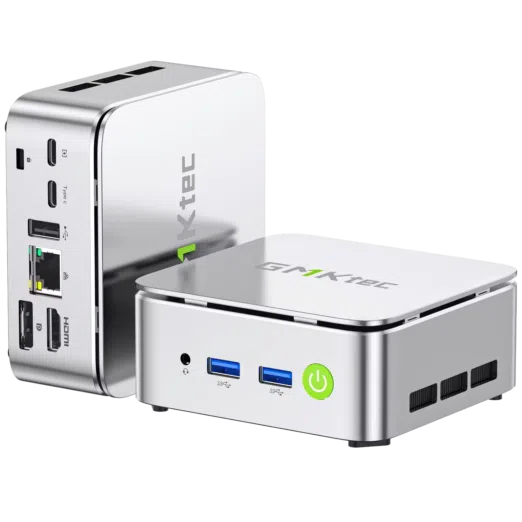 Three-quarter product shot of two silver GMKtec G10 Mini PCs on a black background, showcasing the reflective metallic chassis, the front ports with the green power button, and the rear I/O connectivity options.
