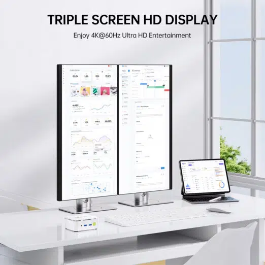 Triple display workstation setup showing a silver GMKtec G10 Mini PC driving two vertical monitors and an adjacent tablet display simultaneously at 4K resolution at 60Hz.