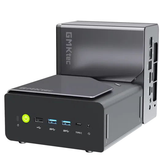 A product shot showing two identical compact mini PCs on a solid black background. One unit sits horizontally in the foreground, displaying its front panel with a glowing green power button, three USB-A ports, a Type-C port, and a headphone jack. The second unit is placed vertically directly behind it, showcasing its sleek gray side panel with the "GMKtec" logo and a view of the rear I/O connectivity ports.