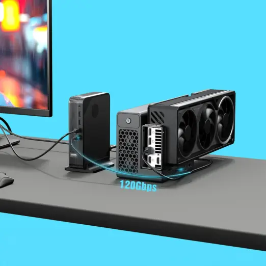 GPD BOX Mini PC front view with black ribbed case cabled to triple-fan PCIe eGPU, 120Gbps glow