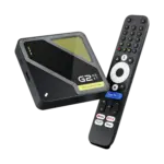 Angled RockTek G2 Next Google TV box in glossy black with yellow vent, beside matte number-button voice remote